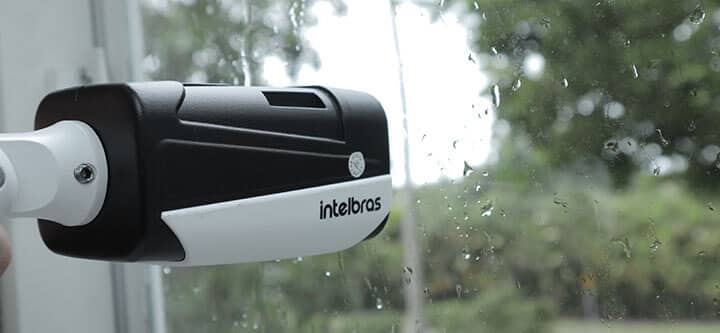Bullet camera without sunshield behind glass
