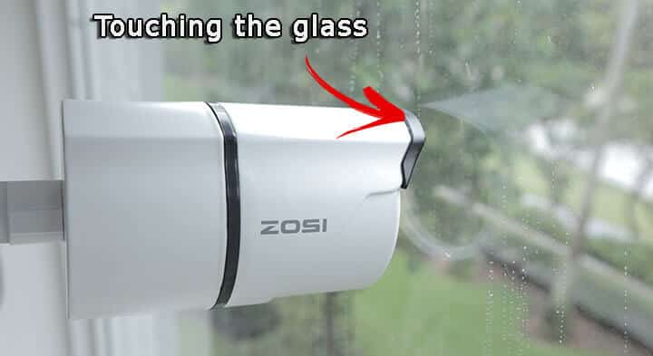 Security camera behind glass reflection